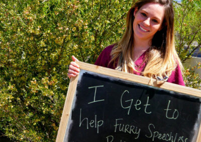 A picture of a person holding a chalk board