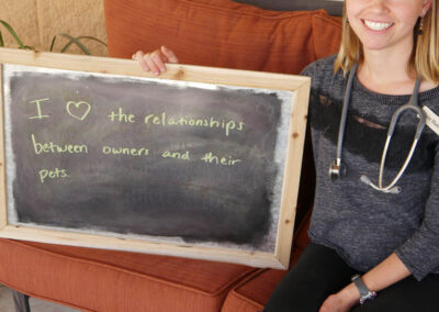 A picture of a person holding a chalk board