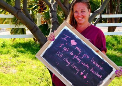 A picture of a person holding a chalk board