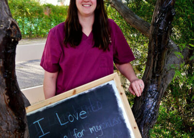 A picture of a person holding a chalk board