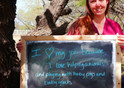 A picture of a person holding a chalk board