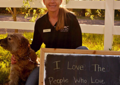 A picture of a person holding a chalk board