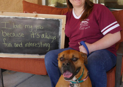 A picture of a person holding a chalk board