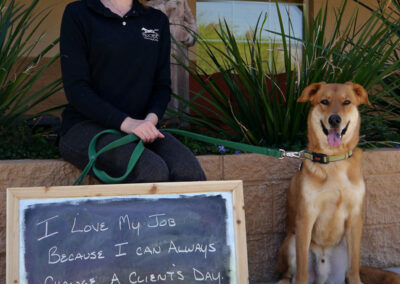A picture of a person holding a chalk board