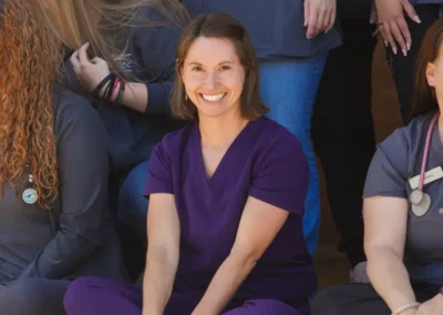 Adobe Veterinary Center team posing for a photo in scrubs.